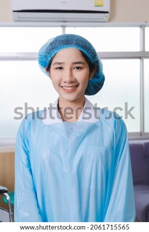 portrait of an Asian nurse smiling. Vertical