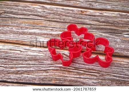 Christmas cookie cutters on wooden table.