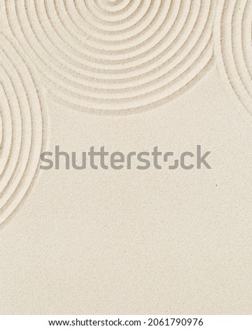 Pattern in Japanese Zen Garden with concentric circles on sand for meditation and tranquility. Aesthetic minimal sandy background. Top view.
