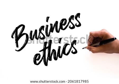 Hand writing inscription Business Ethics with black marker, concept. Business Ethics, business concept background.