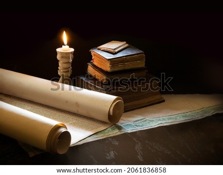 Grunge age dirty rough rustic brown open psalm pray talmud law paper page archive stack dark black wooden desk table space. New jew culture god Jesus Christ gospel literary art wood still life concept Royalty-Free Stock Photo #2061836858