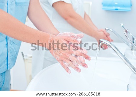 Surgeon washing hands before operation Royalty-Free Stock Photo #206185618