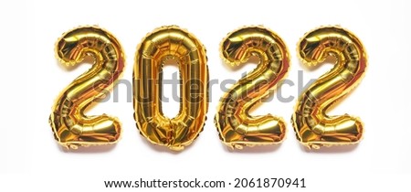 Gold foil balloons isolated on white background. Decoration holiday Happy new year 2022.