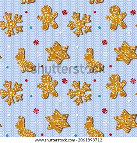 Christmas seamless pattern with gingerbread cookies on blue knitted background. Xmas homemade biscuits in shape of rabbit and gingerbread man, snowflake and star. Vector illustration Royalty-Free Stock Photo #2061898712