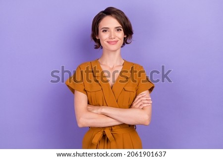 Photo of young attractive woman happy positive smile confident crossed hands isolated over violet color background