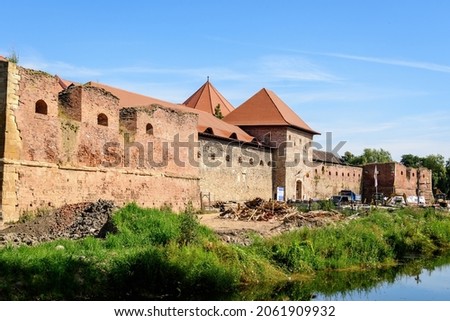 Renovated old historical buildings  of Fagaras Fortress (Cetatea Fagaras) during renovation works in a sunny summer day, in Transylvania (Transilvania) region, Romania