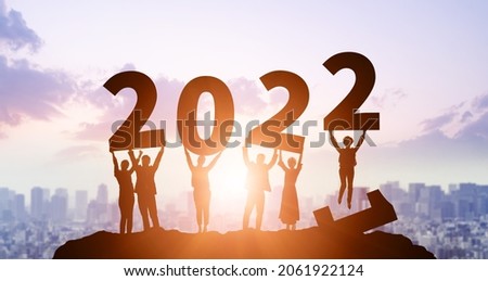 New year concept of 2022. New year's card. Multi ethnic people showing 2022.