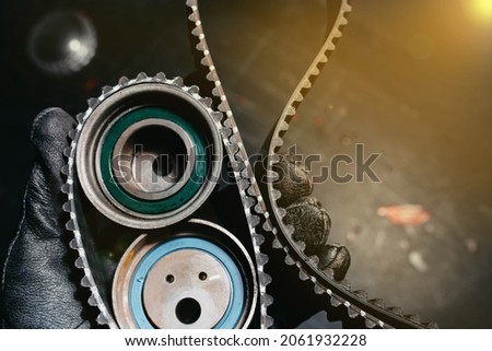 timing belt and tension rollers of the gas distribution system of the car engine, the concept of car maintenance Royalty-Free Stock Photo #2061932228