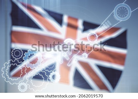 Double exposure of abstract virtual robotics technology hologram on British flag and sunset sky background. Research and development software concept