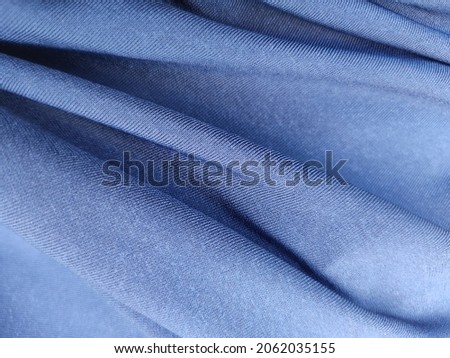 Fabric jersey spandex blue colour. This fabric has elastic properties. Royalty-Free Stock Photo #2062035155