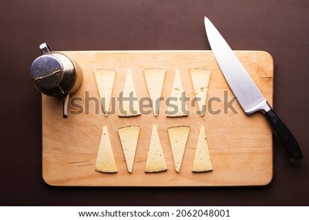 Product Photography, Still Life. Cheese with Oil and knife.