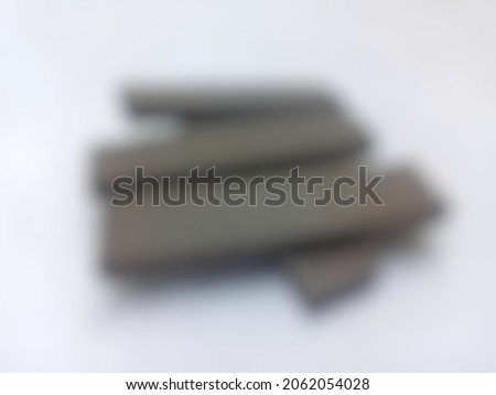 Defocused abstract background of chocolate waffer food group on gray background