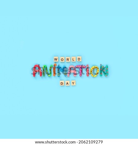 World animation day concept. wooden letters and funny colorful letters made of plasticine on blue background. minimal style. flat lay
