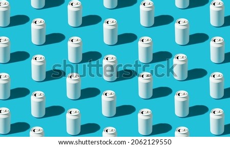 White beverage cans pattern on the bright blue background. Minimal concept. Royalty-Free Stock Photo #2062129550