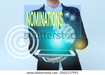 Text caption presenting Nominations. Word Written on action of nominating or state being nominated for prize Woman In Uniform Holding Mobile Phone Showing Futuristic Virtual Icons