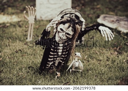 Skeleton grave. Scenery for Halloween in October. Decoration in the yard