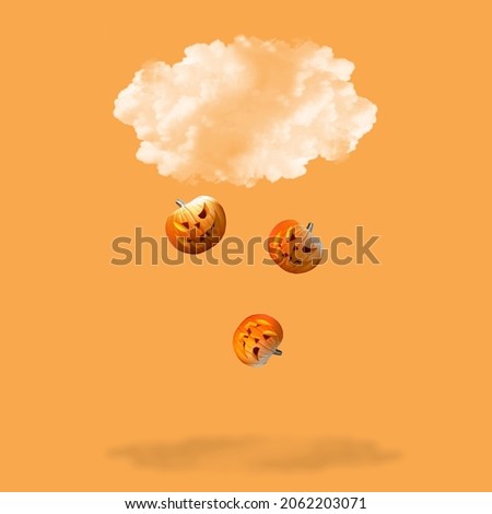 Halloween pumpkins falling from the cloud