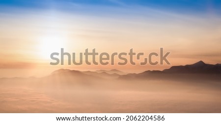 Oil painting style. Beautiful sunrise in the mountains. Mountains on the sky background. Traveling along the mountains, freedom and active lifestyle concept. Abstract landscape. Vibrant photo wallpape