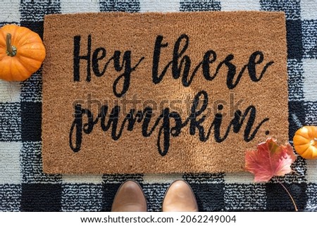Top view of stylish fall rug with pumpkins Royalty-Free Stock Photo #2062249004