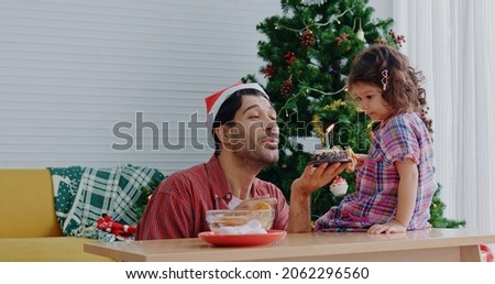 Caucasian father and little daughter family happy Christmas eve celebrations and new year living room in home. Love and care  children. Weekend activity happy family lifestyle together with happiness.