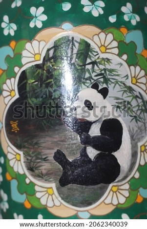 A vase with panda pictures 
