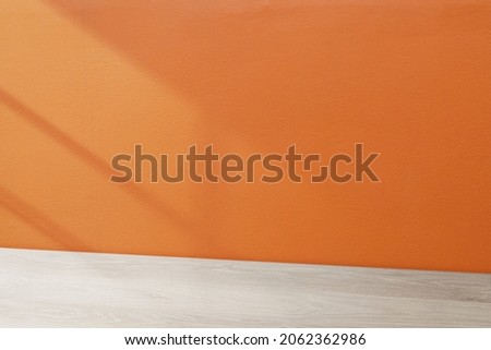 Wooden table product backdrop, orange wall design