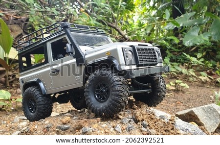 Land Rover Defender Model vehicle 1:12 scale full proportional RC car. 4x4 off road driving  Royalty-Free Stock Photo #2062392521