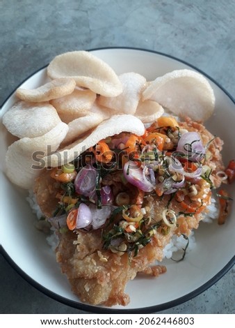 Closeup photo of Balinese cuisine Sambal Matah with Dory Fish
