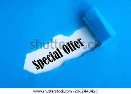 Special Offer appearing behind torn paper.
