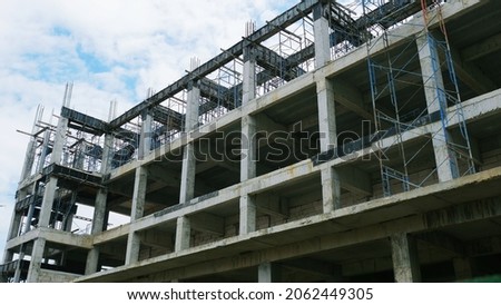 The building under construction overlooking the sky and clouds.