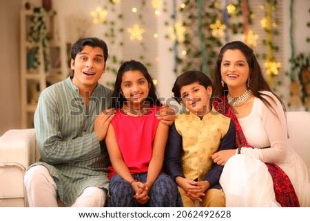 happy family celebrating diwali festival with full of happiness