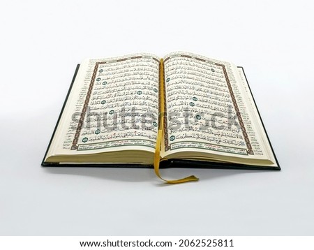 Opened Quran for Muslim to recites as a devotion to God. Royalty-Free Stock Photo #2062525811