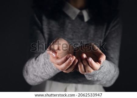 Female hands show something. Woman empty palms