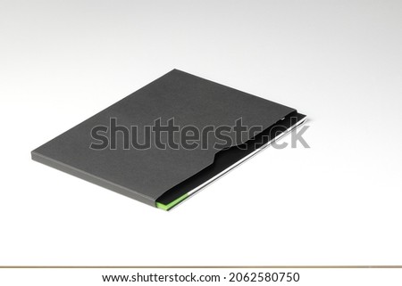 black document envelope for paper A4, C4 size or manual set book isolated on white background.