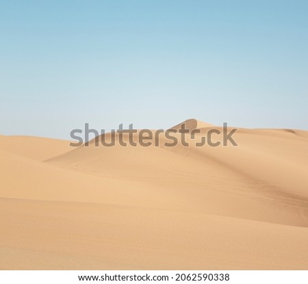 Footprints in the orange sand dunes of Erg Chebbi desert People take an extreme hike through in desert Empty desert