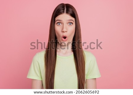 Portrait of astonished girl amazed shocked surprised fake novelty news isolated over pastel color background
