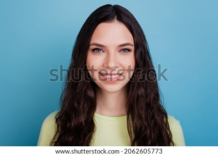 Photo of sweet stunning girl look camera toothy beaming smile on blue background