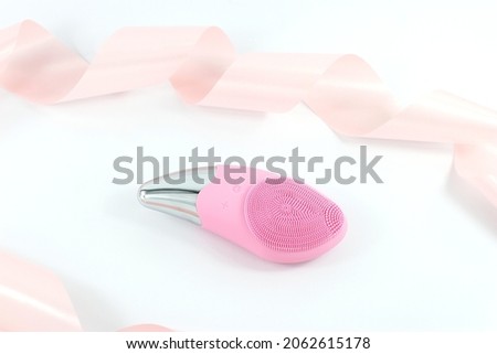 Pink facial massage sonic brush with gift ribbon