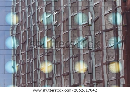 skyscraper reflected in the glass facade
