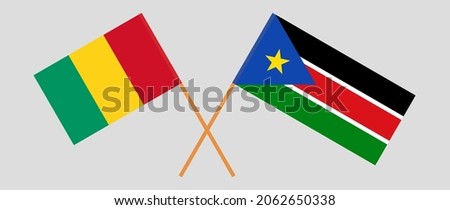 Crossed flags of Guinea and South Sudan. Official colors. Correct proportion