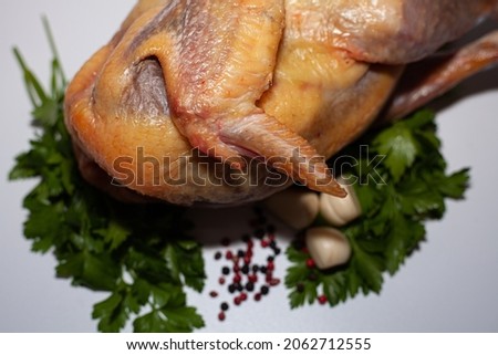 Guinea fowl meat with greens and spices. Organic delicious guinea fowl meat Royalty-Free Stock Photo #2062712555