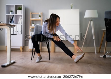 Stretch Exercise Workout Near Office Desk. Worker Stretching Royalty-Free Stock Photo #2062726796