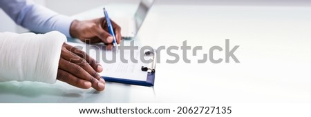 Worker Filling Social Security Benefits And Disability Insurance Compensation Claim Royalty-Free Stock Photo #2062727135
