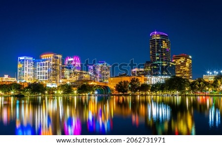 Downtown Orlando, Florida skyline over Lake Eola at night. Royalty-Free Stock Photo #2062731971