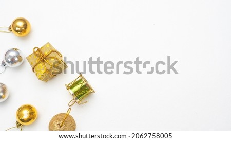 Close up christmas objects gold and silver top view copy space white background