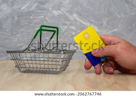 shopping cart and hand with credit card concept online business. High quality photo