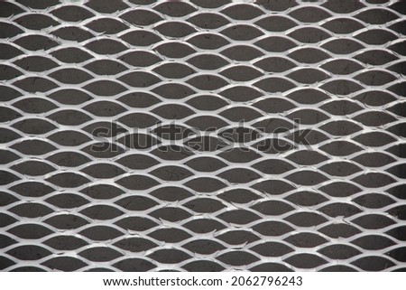 Beautiful metal shiny fence mesh. Backgrounds