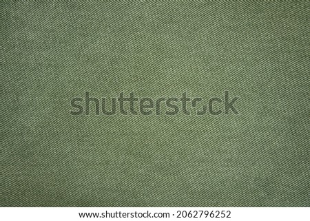 Green jean shirt isolated on white background. Close-Up Of Denim Jacket. Denim jeans background pocket with seam. Casual urban classic fashion tailoring clothing concept. Royalty-Free Stock Photo #2062796252