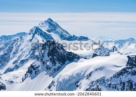 Switzerland, Panoramic view on Snow Alps and Blue Sky around Titlis mountain Royalty-Free Stock Photo #2062840601