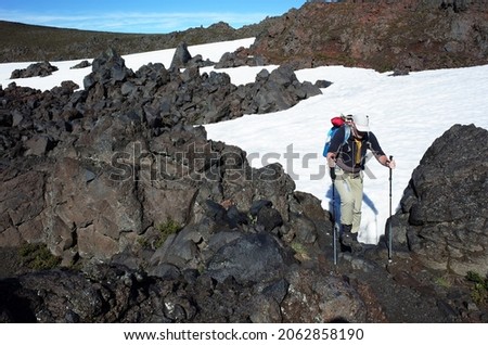 Trekking Villarrica traverse hiking trail, Solidified lava field with snow in Villarrica national park in Chile Royalty-Free Stock Photo #2062858190